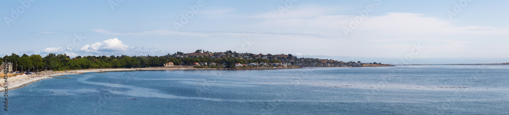 Panoramic View of Residential Homes in a modern city on the West Coast of Pacific Ocean. Victoria, Vancouver Island, British Columbia, Canada. Sunny Summer Day.