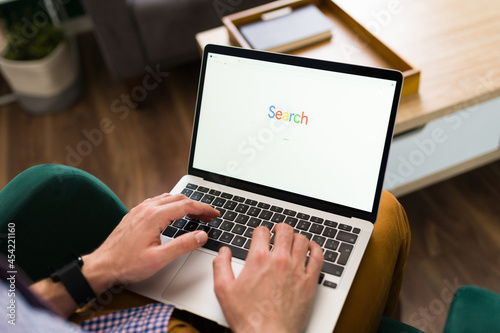 Young man using a search engine