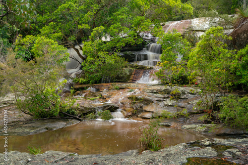 long exposure shot of the top section of somersby falls near gosford on the nsw central coast photo