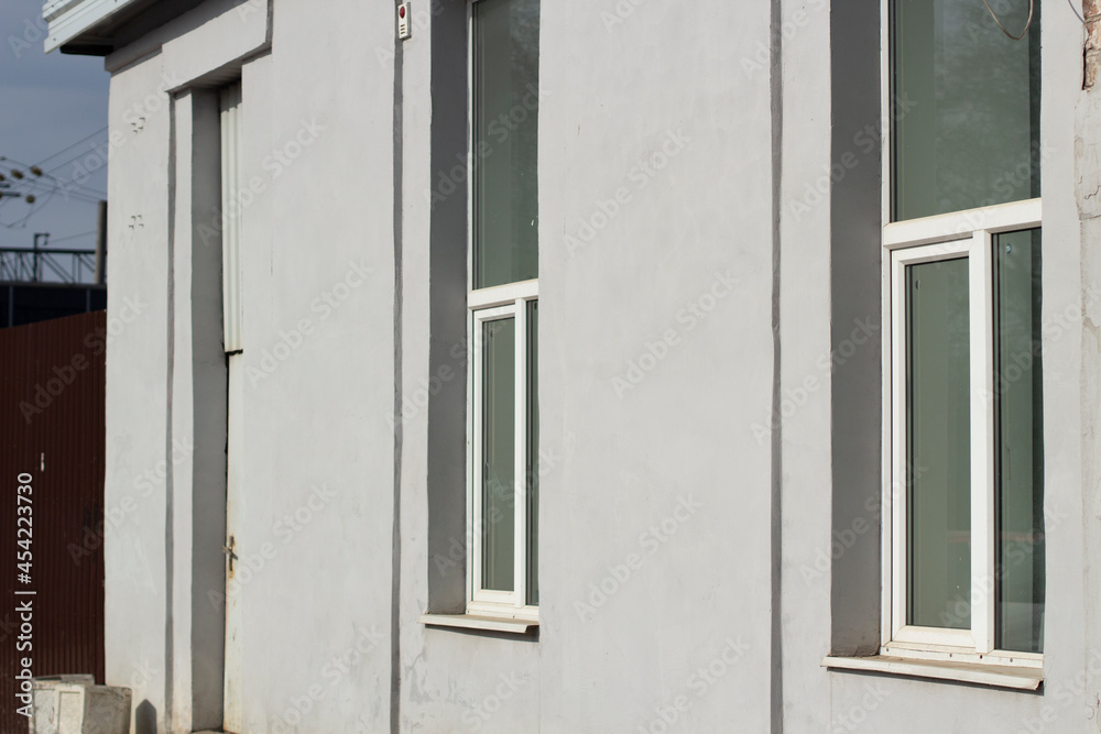 Fototapeta premium The windows in the building. Architectural structure in the city.