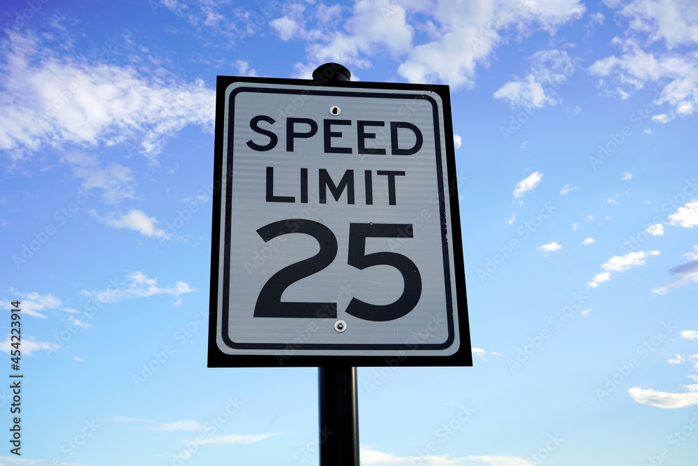 Speed Limit 25 mph with cumulative clouds in background. Speed Limit 25 mph with cumulative clouds in background.