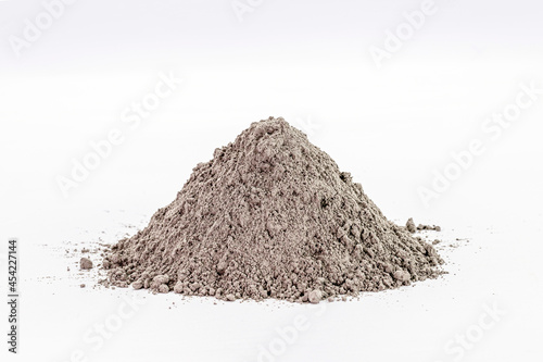 Cement dust pile on isolated white background, construction material.