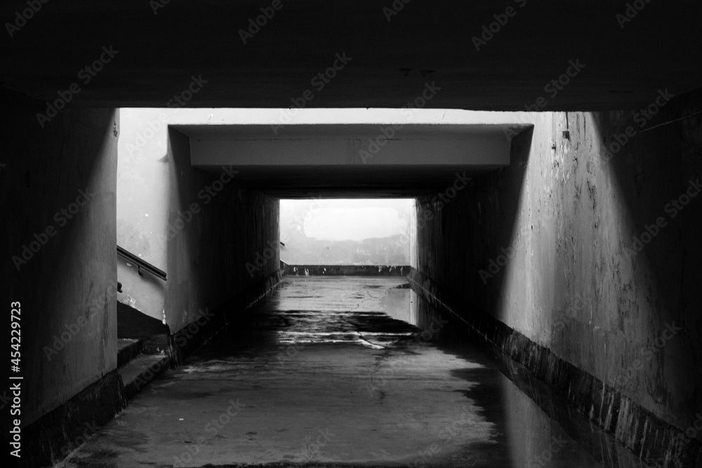 Old underground passage in train station - black and white point of view shot. Old underground passage in train station - black and white point of view shot.