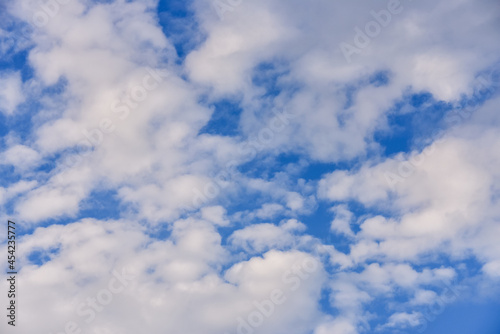 blue sky background with cumulus white clouds