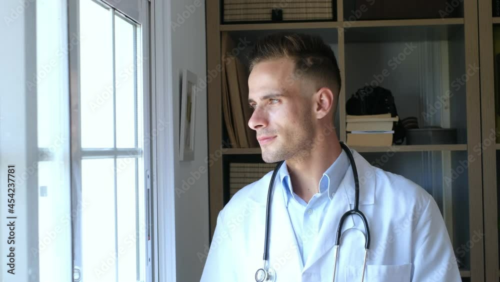 Pensive young male caucasian doctor in white medical uniform look in window distance thinking or pondering, serious man GP plan future career or success in medicine, visualize at workplace writing
Pensive young male caucasian doctor in white medical uniform look in window distance thinking or pondering, serious man GP plan future career or success in medicine, visualize at workplace writing