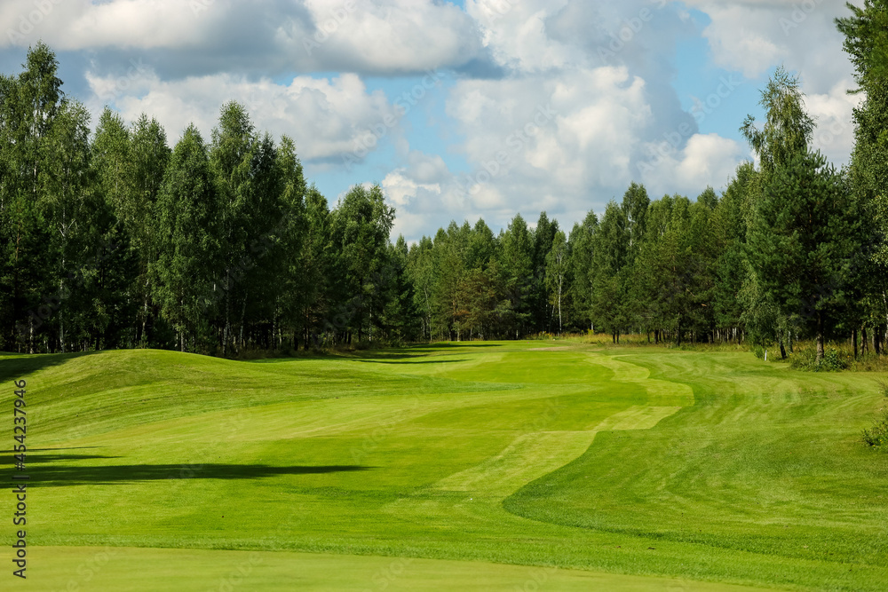 Panorama view of a Golf Course with fairway field. Golf course with a rich green turf beautiful scenery. High quality photo Panorama view of a Golf Course with fairway field. Golf course with a rich green turf beautiful scenery. High quality photo