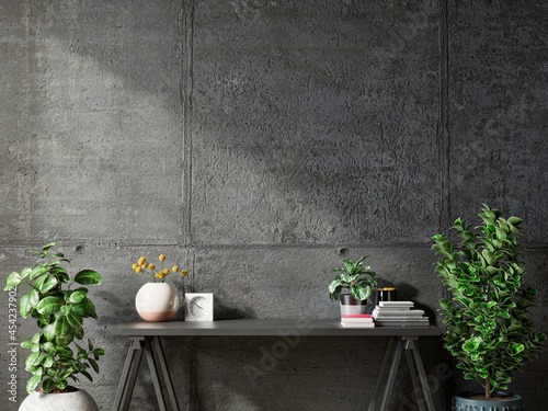 Mockup concrete wall with ornamental plants and decoration item on table.