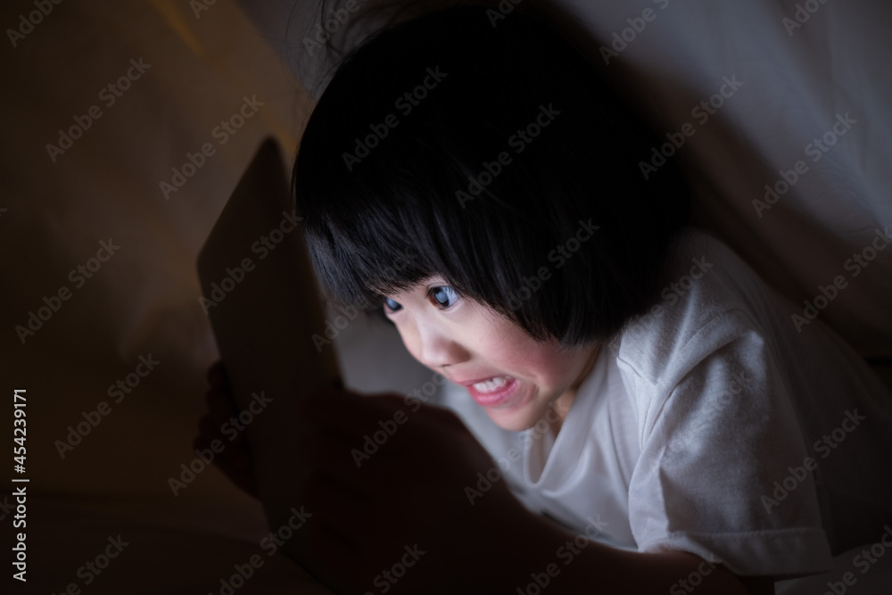 kid watching tablet on the bed, child addicted cartoon
kid watching tablet on the bed, child addicted cartoon