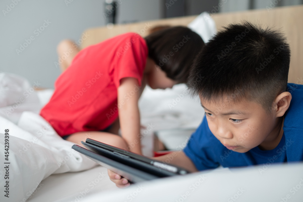two children addicted tablet, asian kid watching cartoon
two children addicted tablet, asian kid watching cartoon