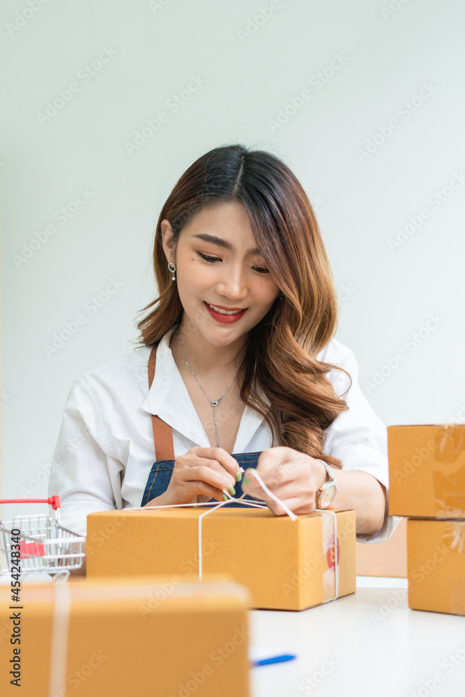 SME business online and delivery concept, freelance woman working at home with Online Parcel delivery. SME business online and delivery concept, freelance woman working at home with Online Parcel delivery.