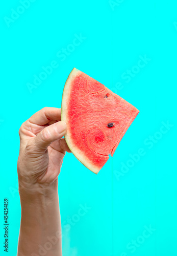 Watermelon slice fruit in hand