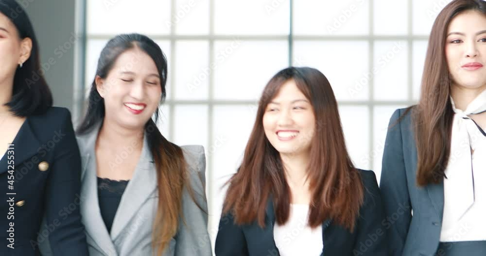 Group of young and cute colleagues new employees in business clothes waking and taking together in modern office with a fun and intimate action. Group of young and cute colleagues new employees in business clothes waking and taking together in modern office with a fun and intimate action.