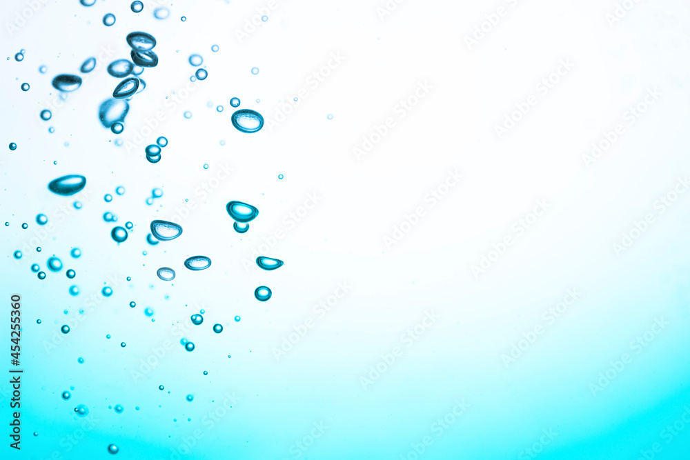 Close up, Pure Blue Water Splash with Air Bubbles on White Background Close up, Pure Blue Water Splash with Air Bubbles on White Background