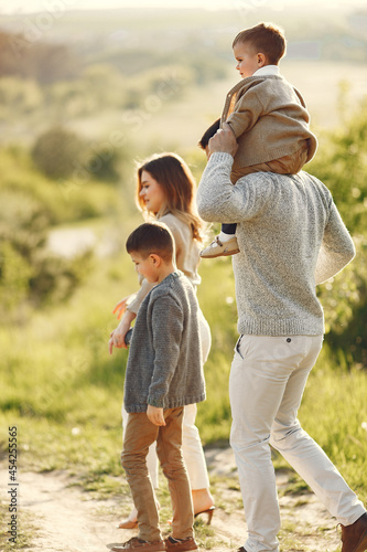 Cute family playing in a summer field