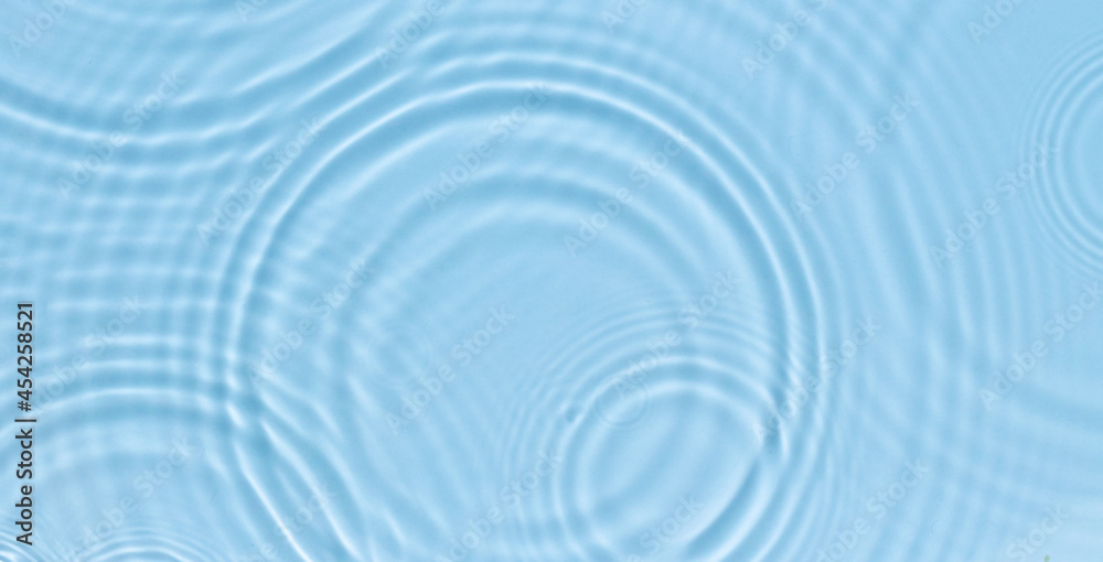 Water panoramic banner background. White aqua texture, surface of ripples, rings, transparen and sunlight. Spa concept background. Flat lay, top view, copy space Water panoramic banner background. White aqua texture, surface of ripples, rings, transparen and sunlight. Spa concept background. Flat lay, top view, copy space