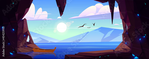 Cave in rock with blue crystals and view to lake and mountains on horizon. Vector cartoon landscape of stone cavern entrance, sea, wooden boat, flying birds, sun and clouds in sky
