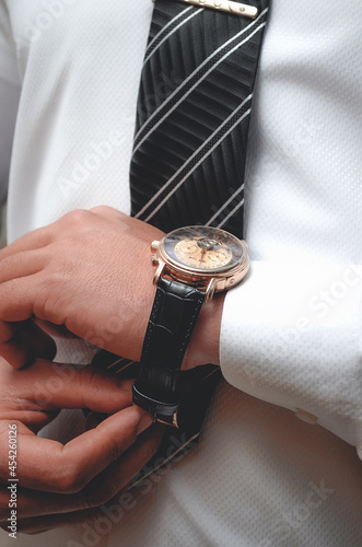 Wristwatches for men. A luxury mechanical watch on the hands of a man.