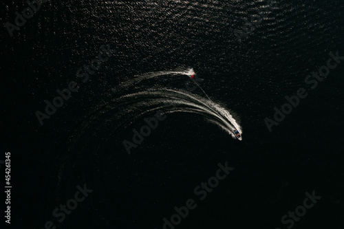 Top view of speedboat with wake during water sports activity photo