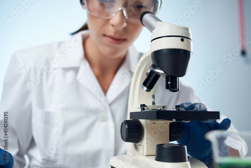 female laboratory assistant science research microbiology