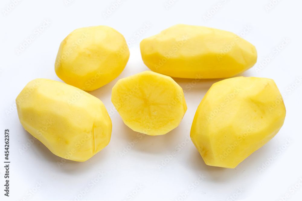 Raw peeled potatoes on white background