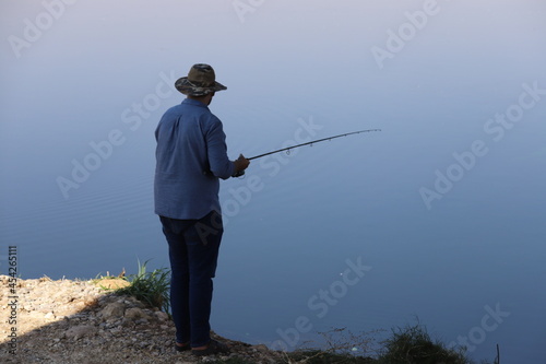 man fishing on the lake