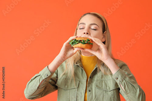 Young woman eating tasty ve...