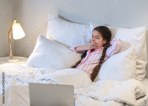 Tired girl watching cartoon...