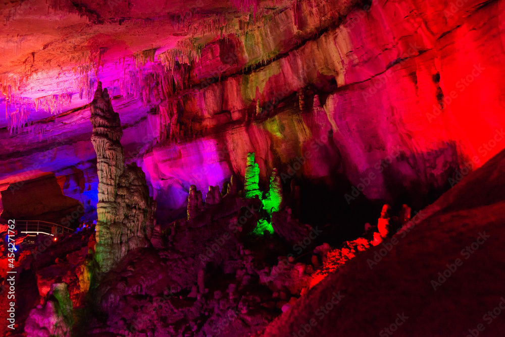SATAPLIA, KUTAISI, GEORGIA: Sataplia cave in Georgia illuminated by colorful lights.