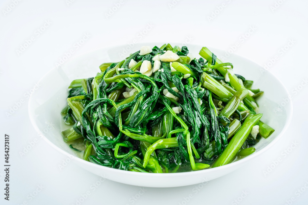 Garlic convolvulus in a dish on white background Garlic convolvulus in a dish on white background
