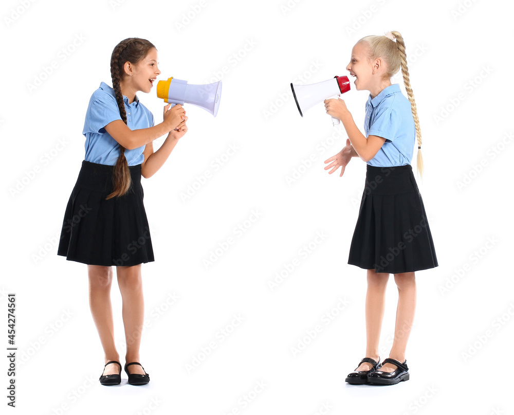 Cute schoolgirls with megaphones on white background Cute schoolgirls with megaphones on white background