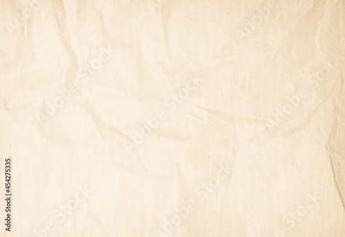 Brown recycled paper crumpled texture background. Cream Old vintage page