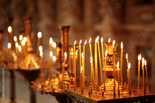 Many Long Burning candles during church service