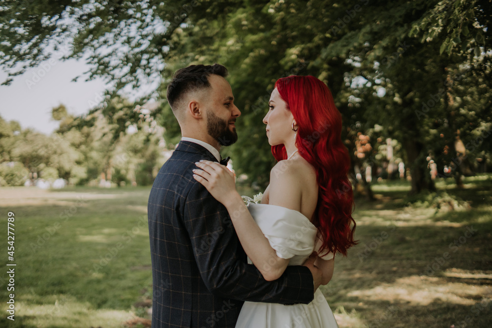 Wedding day. Happy bride and groom hugging and laughing Red hair diversity Wedding day. Happy bride and groom hugging and laughing Red hair diversity