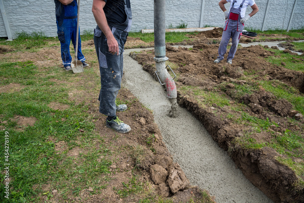 Concrete pump truck  pours the concrete to the ground