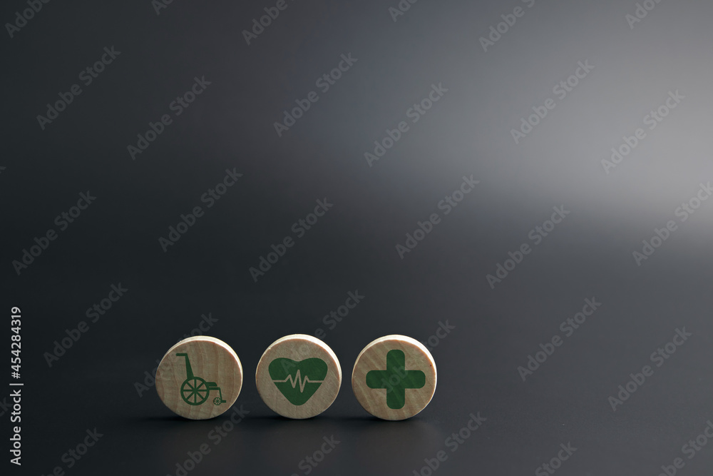 Wooden block with medical icons. concepts of Medical health care, insurance for your health, health management. with copy space Wooden block with medical icons. concepts of Medical health care, insurance for your health, health management. with copy space