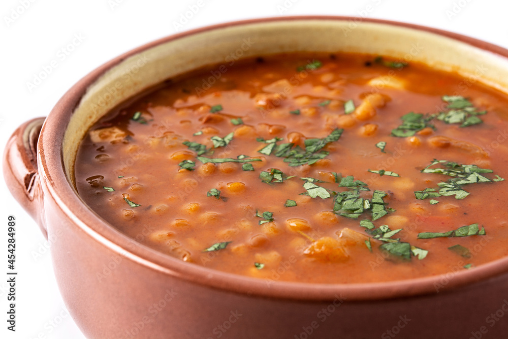 Red lentil soup isolated on white background. Close up Red lentil soup isolated on white background. Close up