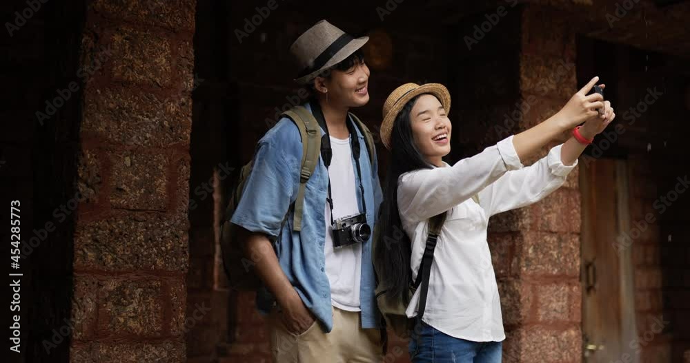 Couple selfie on smartphone in ancient temple Couple selfie on smartphone in ancient temple