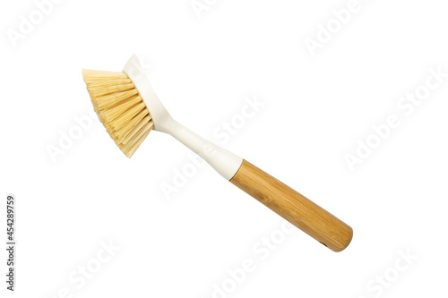 Wooden dish brush with bamboo wood and natural Bristle Tampico Fiber, on white background . Item for cleaning in kitchen. photo
