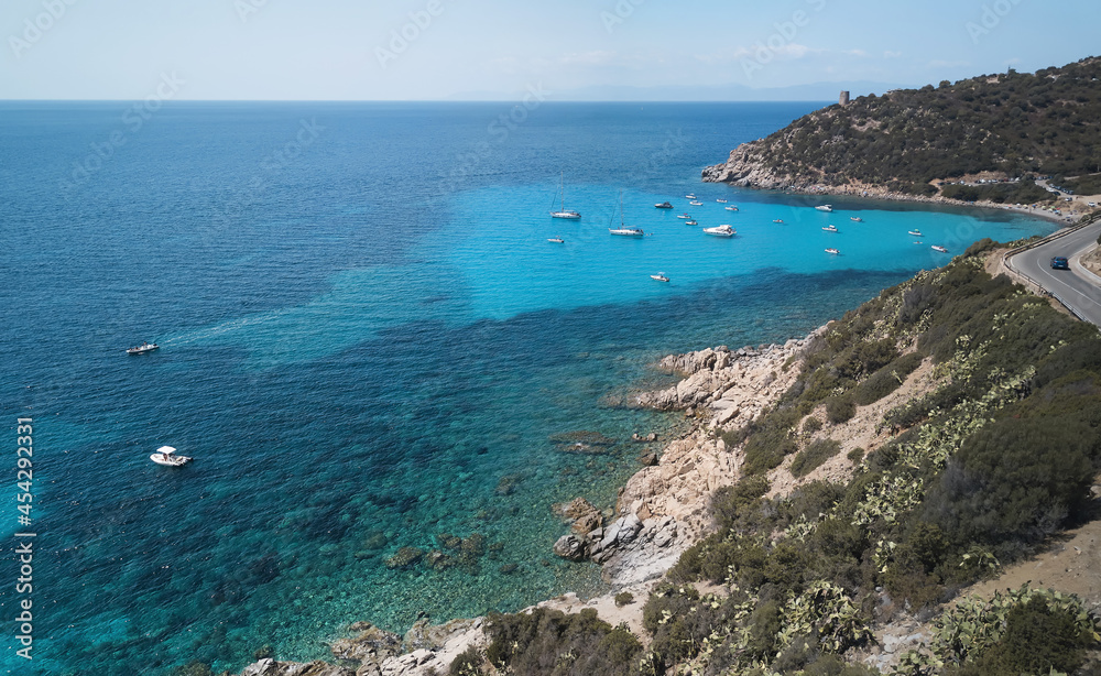 Aerial view of turquoise sea in the little bay in the south of Sardinia (CALA REGINA) travel destination .