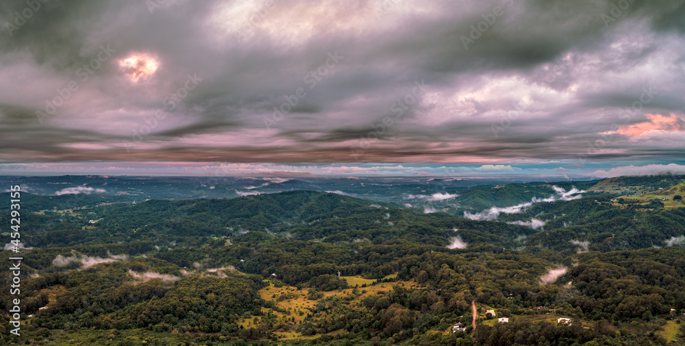 Cloudy sunset over the Sunshine Coast, with low clouds scattered throughout the valleys