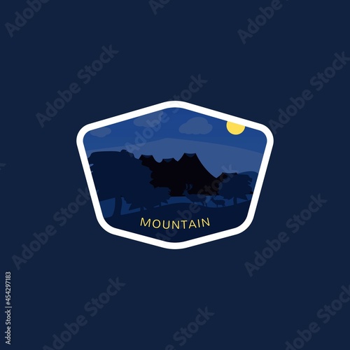 The landscape design of the mountain and two deer in the darkness of the night. packaged in a polygon frame with a blue background.