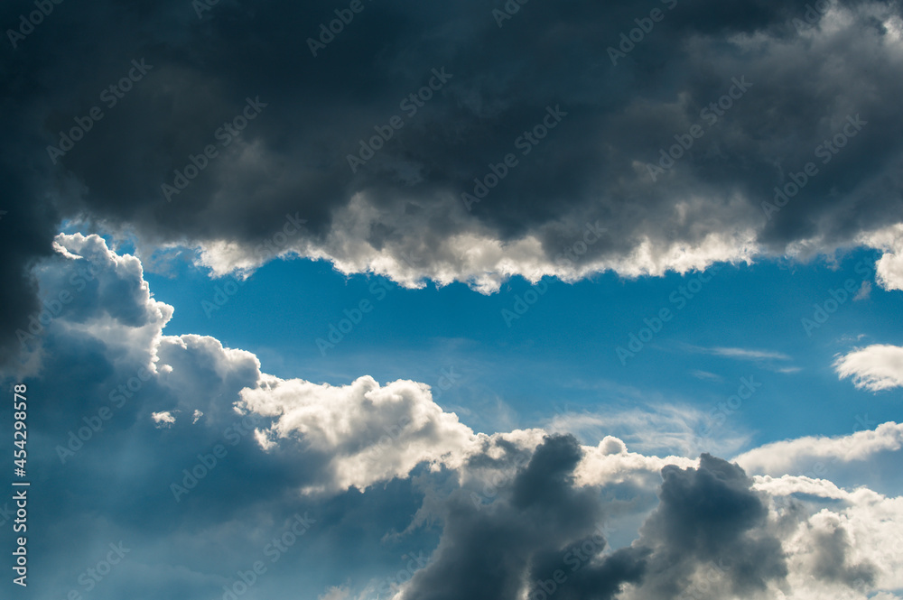 Fototapeta premium blue sky with dramatic cloudscape fly trough