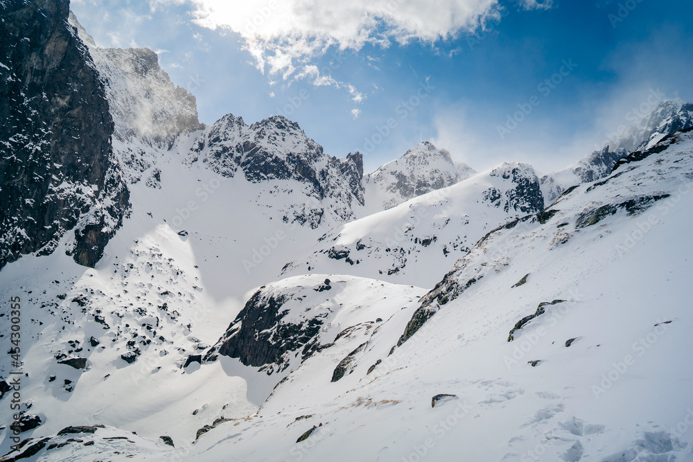 Winter panorama of mountains above the clouds. View of the High Tatras Winter panorama of mountains above the clouds. View of the High Tatras