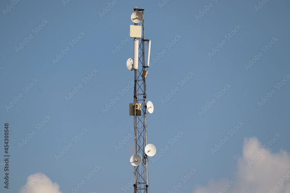 Mathura, Uttar Pradesh India- August 25 2021: A tall mobile towers with clear background sky. Telecom service provider for the advanced 5g internet connection. Mathura, Uttar Pradesh India- August 25 2021: A tall mobile towers with clear background sky. Telecom service provider for the advanced 5g internet connection.