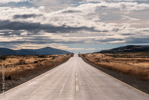 Highway theme picture. Highway concept picture. Amazing autumn. The natural landscape of the Patagonian plateau. Travel in Chile in South America.