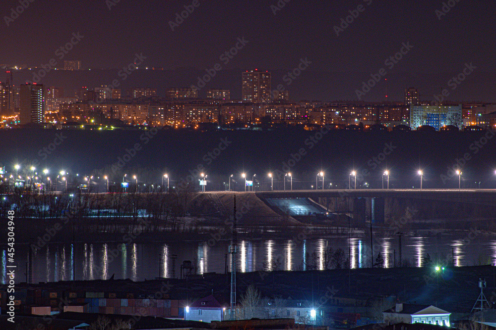 Fototapeta premium the bridge glows with lights in the night 