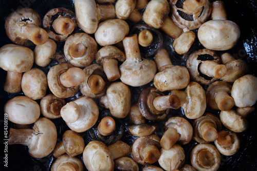 texture of mushrooms fried in sunflower oil close up
