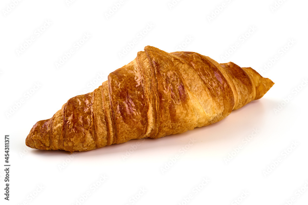 Freshly baked croissant, isolated on white background.