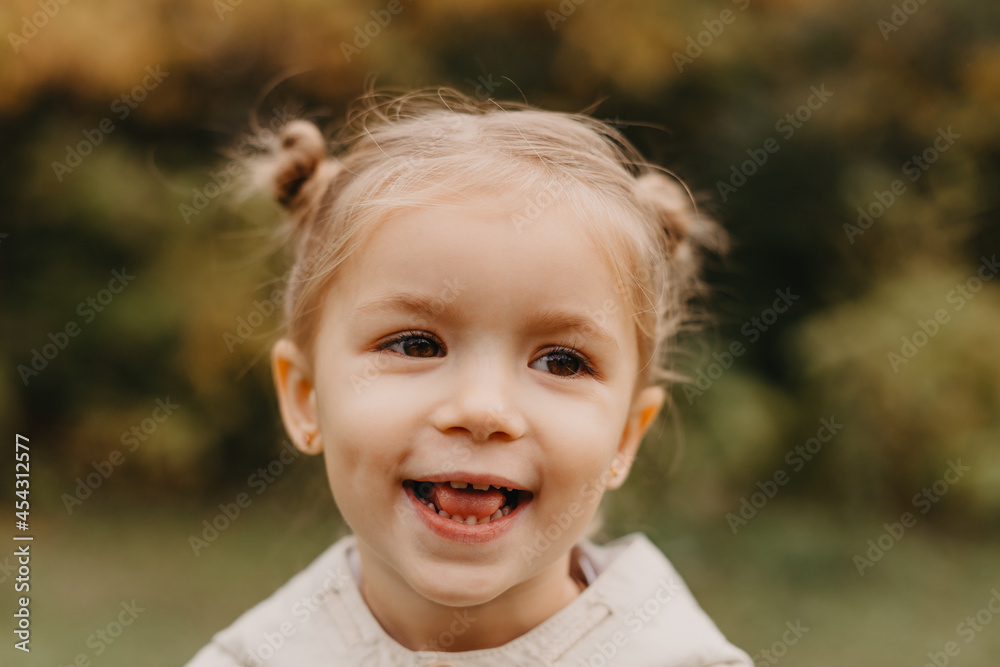 portrait of a girl who grimaces, shows different emotions when walking in the autumn park portrait of a girl who grimaces, shows different emotions when walking in the autumn park