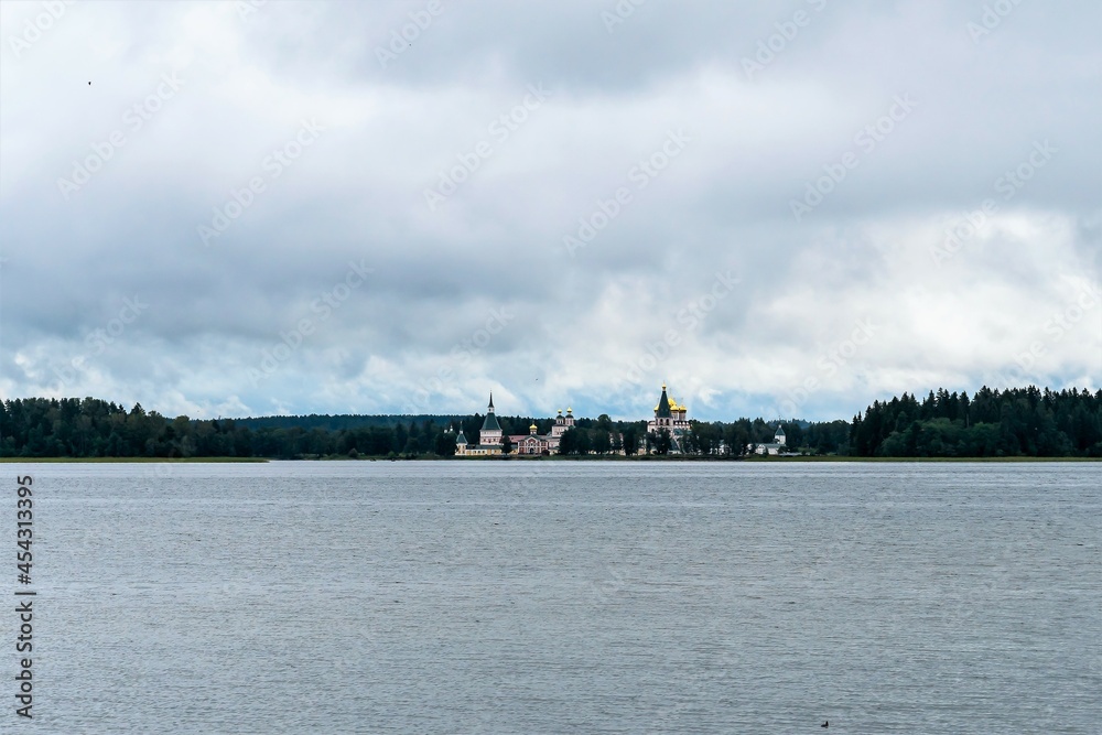 Russia, Valdai, August 2021. A distant view of the Orthodox monastery on the island.